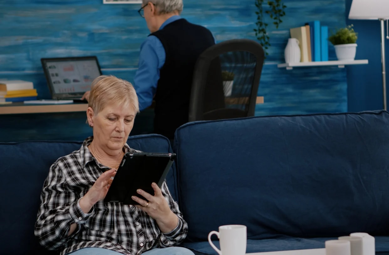 A care manager calmly reviewing cover on her phone.