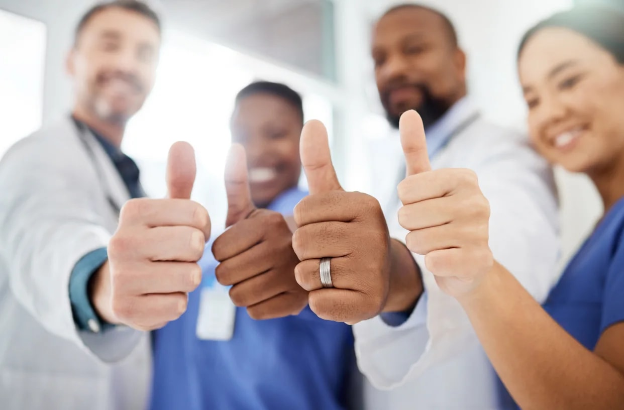 Two care colleagues talking positively at the end of a shift.
