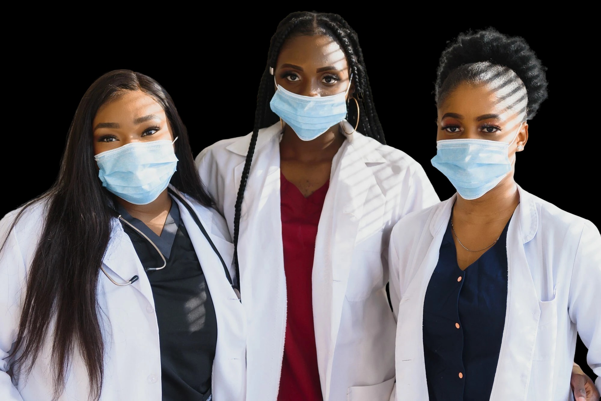 Three care professionals in white coats.