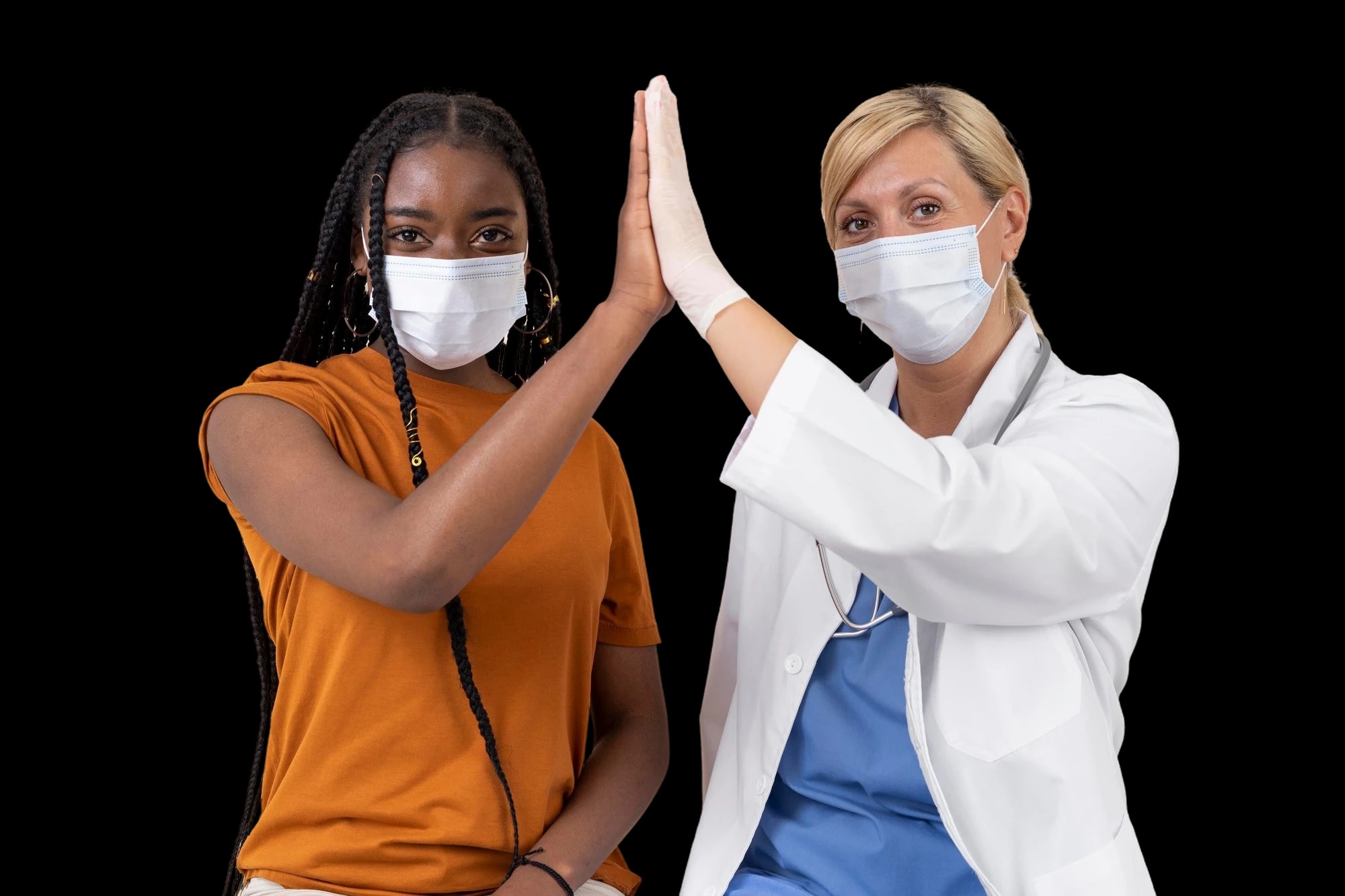 A young woman and a nurse sharing a high five.